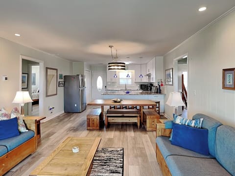 Open-Concept Living Room with Dining and Kitchen Access