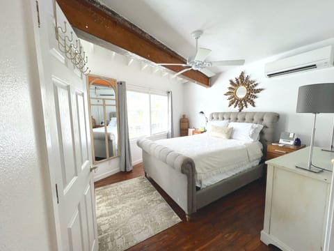 Bedroom w/lots of natural light and blackout curtains, ductless air & cozy bed!