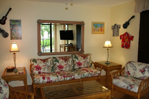 Spacious living room with large flat screen TV.
