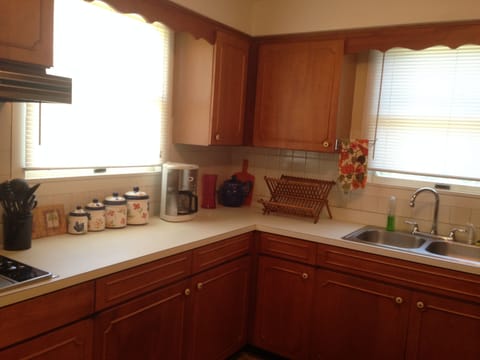 Large Sink Coffee Maker Range top next to Built in Oven