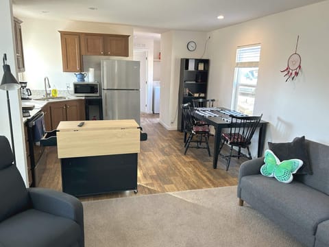 Living dining kitchen area with full size appliances, utensils, pots, pans, etc.