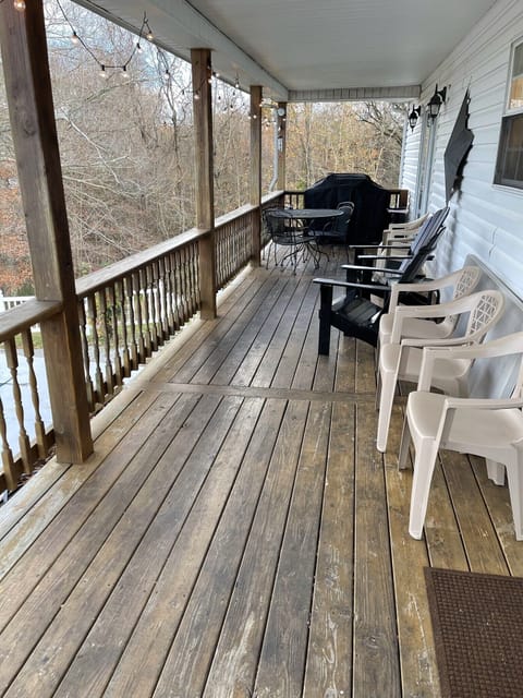 Back porch with grill overlooking pool with scenic view of hills