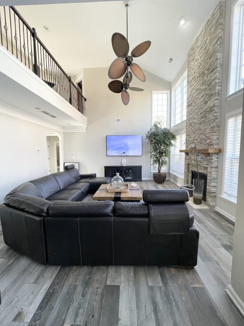 Family room with XL sectional and a 90 inch 3D TV + lots of board games 