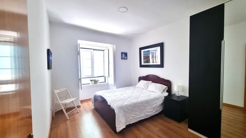 Bedroom with a window to the street 