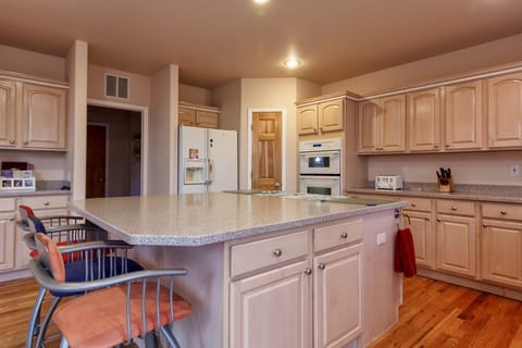 Kitchen.  Large island with gas stove top.  Well stocked.  