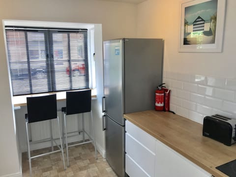 Breakfast Bar in kitchen for two. Large upright fridge/freezer