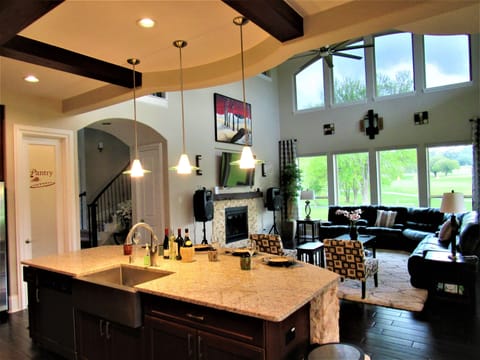 Kitchen/Living Room Overlooking the Golf Course. Fireplace Off.