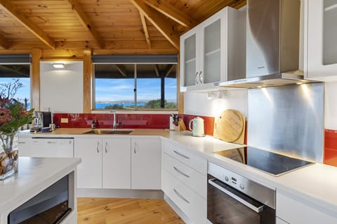 State-of-the-art kitchen with Miele cooktop, oven and rangehood.