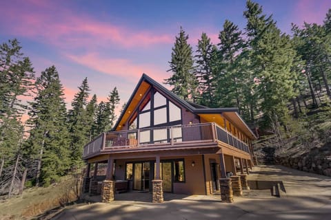 Crestview Lodge - Vacation Rental 365 - Timber-frame mountain lodge with grand A-frame windows and dramatic roofline