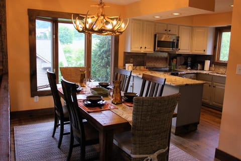 The handmade rough-hewn  solid oak table seats six.