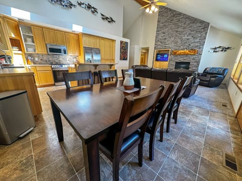 Gather around the dining table with seating for six, perfect for shared meals and memorable conversations. Enjoy the open-concept design that seamlessly connects the dining area, kitchen, and cozy living space