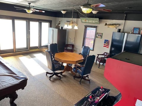 Extra Refrigerator/Freezer next to Sliding Glass Doors leading to outdoor pool.