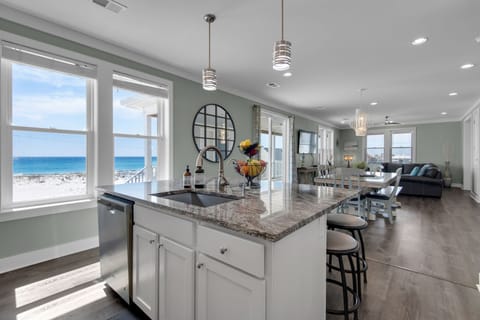 Fully stocked gourmet kitchen with a view, open floor plan, large island