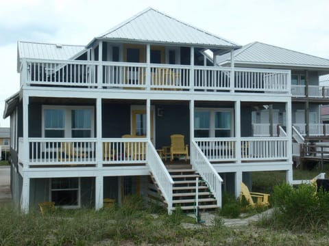 2nd floor back deck. Stairs lead up to the large deck. Seating for up to ten.