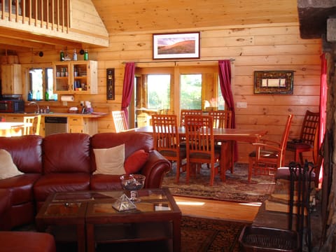 Open concept main floor/great room facing dining area, kitchen, and sun room.