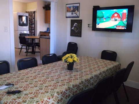 Flat screen TV in Dining Room that seats 8+