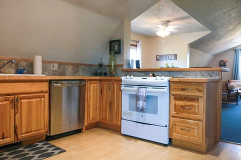 Kitchen with full size dishwasher, refrigerator, and stove