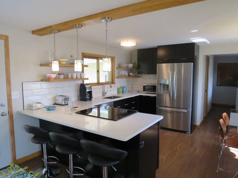 Modern open kitchen with beautiful quartz counters.