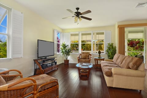 Living room with sofa, two comfortable chairs and 55'' plasma, s