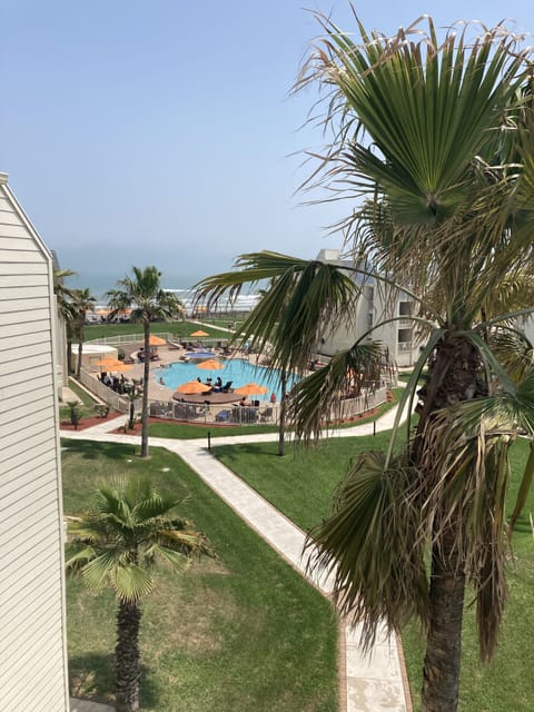 view to the pool from the upstairs bedroom balcony
