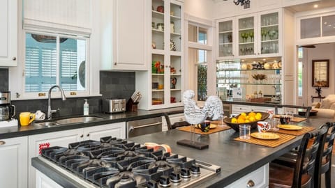 The fully equipped kitchen has premium appliances and all of the tools needed to prepare a meal at home...