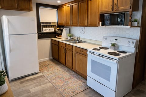 Stocked with pots and pans and all of your kitchen needs.