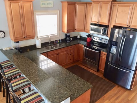 Fully stocked kitchen, seating for 4 at the bar