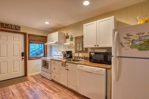 Kitchen stocked with all the essentials & lots of extras! Full size appliances, garbage disposal, microwave, blender, toaster, Keurig, cookware, dishes & glassware, utensils. Even dog feeding bowls/mat & waste bags.