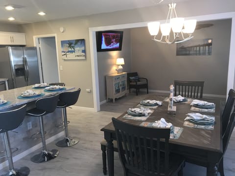 Dining room table with build in extension leaf offers plenty seating. 