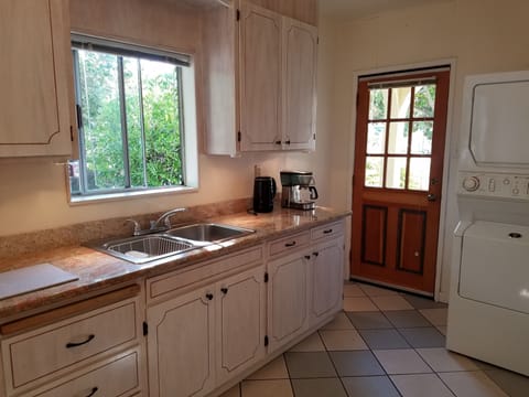Kitchen has microwave, toaster, coffee maker, kettle, full-size washer/dryer.