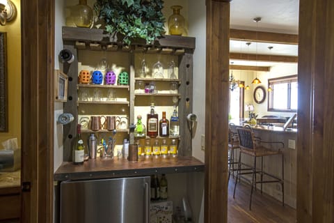 Copper top bar area with wine & beer refrigerator.