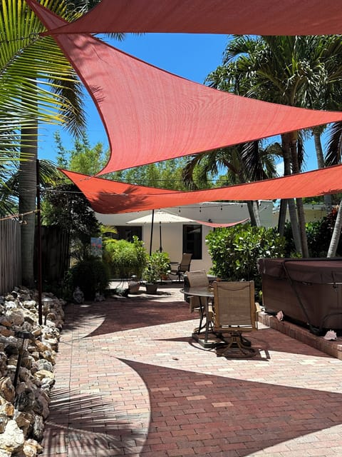 Tropical vibrant entry to patio and LuLu's Cottage.