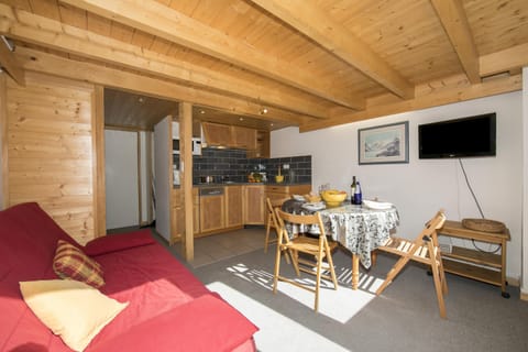 Living room with sofa bed for 2 and a fully fitted kitchen