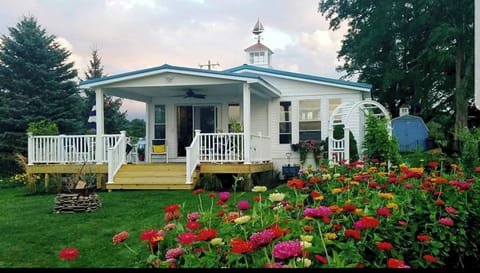 The back covered deck facing the lake and sunset.