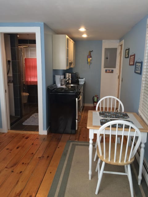 Galley kitchen and dining area