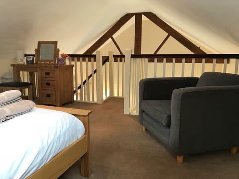 Upstairs galleried bedroom with king size bed