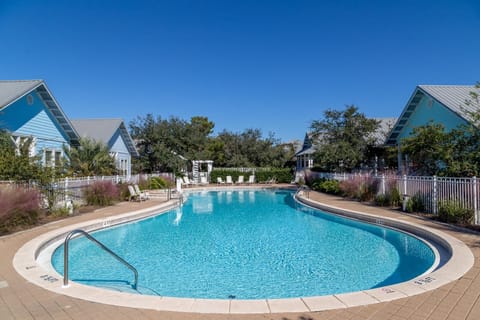 The pool sits just off the porch for ease and convience for families with children or adults that need a dip after a day at the beach!