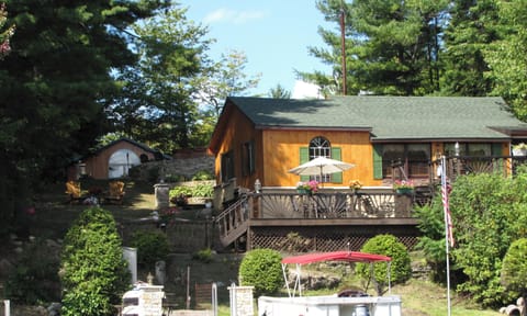 Cottage as viewed from the lake w/bunk house in rear left. Pontoon NOT INCLUDED 