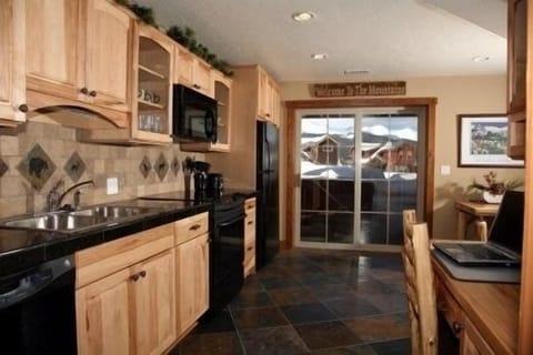 Beautiful, full modern 
kitchen opens up onto the patio and hot tub area