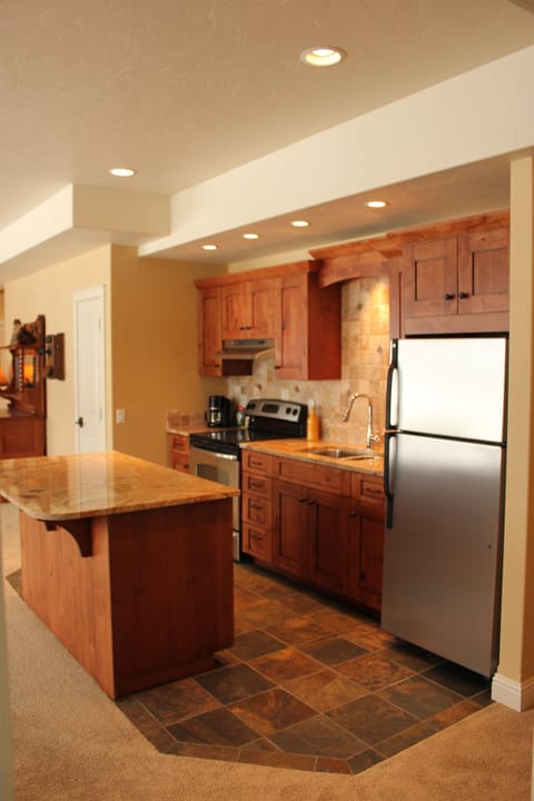 Slate floor and granite countertop makes lower level kitchen top-notch