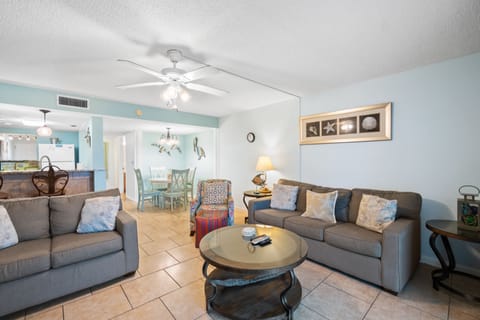 Living room with a sleeper sofa and smart TV. Walk out onto the private patio.