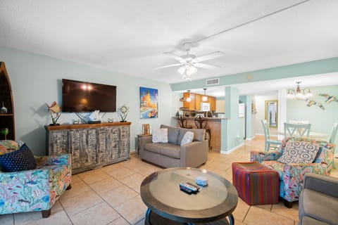 Living room with a sleeper sofa and smart TV. Walk out onto the private patio.