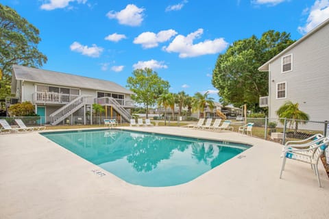 Very convenient pool and sun bathing area next to the unit.