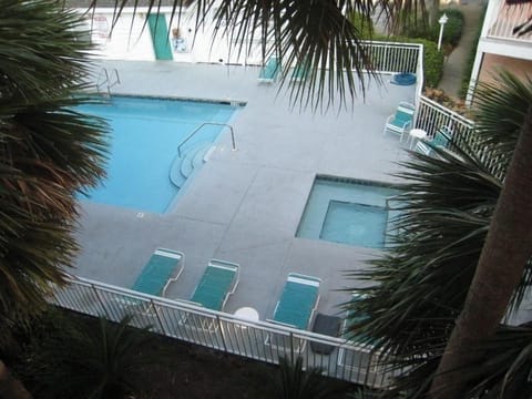 Front pool (heated) with jacuzzi, maybe 25 yards away from front door of unit.