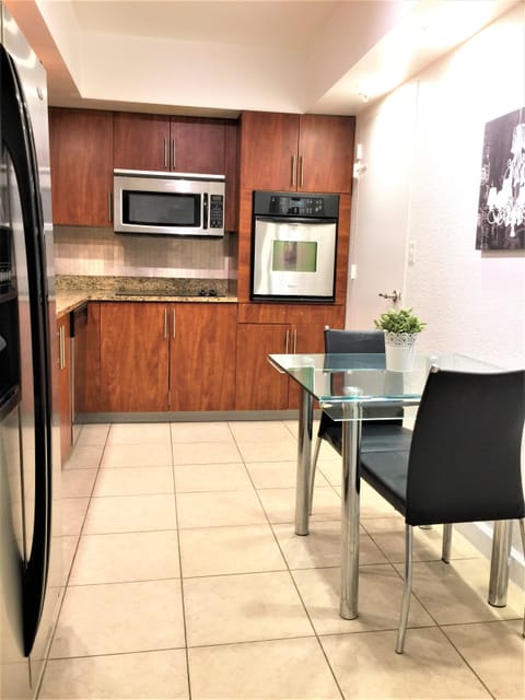 Granite countertop and stainless steel appliances.