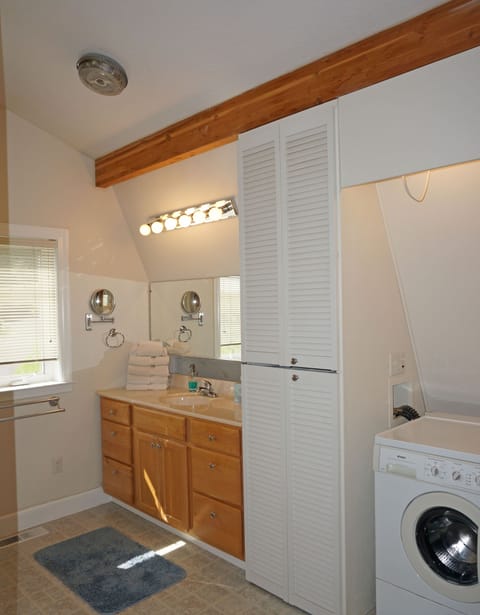 Main bathroom has washer and dryer