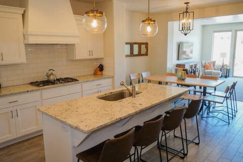 Kitchen Island & Dining Room - The Kitchen Island comfortably seats 4 adults and creates a great space for serving and preparing meals.