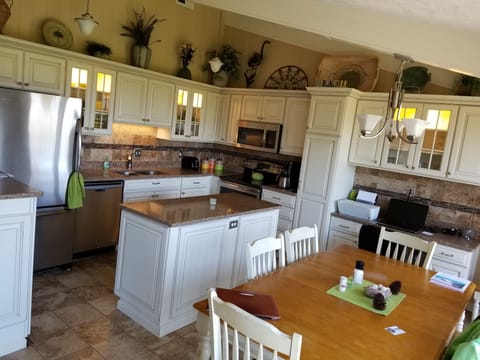 Newly remodeled fully equipped kitchen. Ceramic tile, and granite countertops.