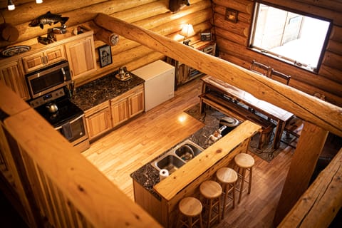 View of kitchen and dining area from loft