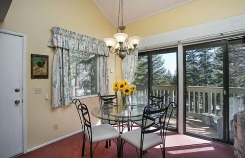 Adorable dining table by patio.